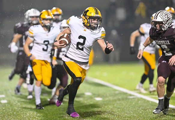 Middlesboro senior quarterback Cayden Grigsby heads up field during Friday’s playoff game at Pikeville. Grigsby ran for 165 yards and a touchdown and passed for 145 yards and touchdown in the Jackets’ 34-14 loss.