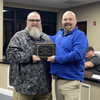 Mr. Jonathan “Mike” Mangus (left) was recognized at this week’s Bell County Board of Education meeting and was awarded a plaque by Superintendent Tom Gambrel (Right).